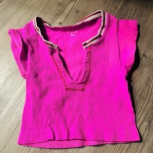 Pink viral out from under urban top